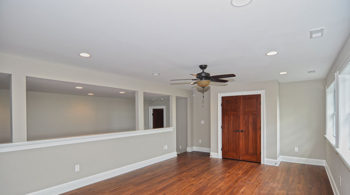 ICH Builders Mt. Sterling residence custom build second floor loft showing the wood floors and ceiling fan